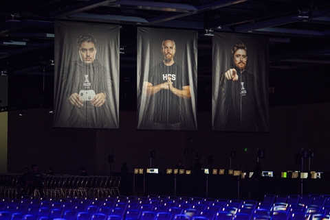 Pro player banners above the seating area.