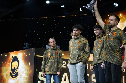 Elamite holding up the Halo World Championship trophy.